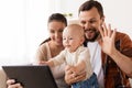 Mother, father and baby with tablet pc at home Royalty Free Stock Photo