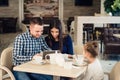 Family, parenthood, technology people concept - happy mother, father and little girl with tablet pc computer having