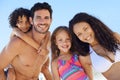 Family, parents and children are happy on beach, portrait while on vacation for summer and sun in Brazil. Travel