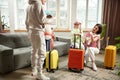 Family, parents with children with luggage ready to depart, showing excitement and anticipation. Holidays together. Royalty Free Stock Photo