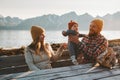 Family parents playing with baby outdoor mother and father with child Royalty Free Stock Photo