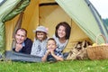 Family Parents and two children in camp tent. Happy Mother, father, son and daughter on Summer vacation Royalty Free Stock Photo