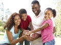 Family In Park With American Football Royalty Free Stock Photo