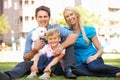 Family in Park with Dog Royalty Free Stock Photo