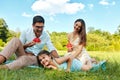 Family In Park. Happy Young Parents And Child Relaxing Outdoors Royalty Free Stock Photo