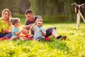 Family in park -Male child blow soup foam and make bubbles in na