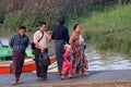 Family passenger walk together from Myanmar traditional ferry across Yangon river on the morning