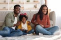 Family Pastime. Cheerful Black Parents Playing Video Games With Daughter At Home Royalty Free Stock Photo