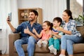 Happy family having video call on tablet computer Royalty Free Stock Photo