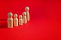 Family people figures on red background. Concept of family, values, unity, togetherness Royalty Free Stock Photo