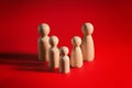 Family people figures on red background. Concept of family, values, unity, togetherness Royalty Free Stock Photo