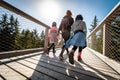 Family people walking wooden treetop bridge canopy walkway in winter