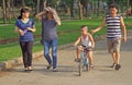 Family of 4 peoples is walking in park, Hanoi