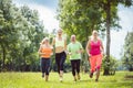 Family with personal Fitness Trainer jogging Royalty Free Stock Photo