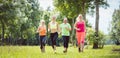 Family with personal Fitness Trainer jogging Royalty Free Stock Photo