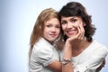 Family photo of a smiling a mother and heer beloved daughter. Royalty Free Stock Photo