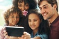 Family photos always look the best. a beautiful young family taking a selfie together outdoors. Royalty Free Stock Photo
