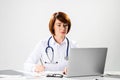 Family physician in white coat with stethoscope