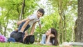 Family Picnic at gaden park Outdoors Togetherness Relaxation Concept with father carrying the kid Royalty Free Stock Photo