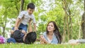 Family Picnic at gaden park Outdoors Togetherness Relaxation Concept with father carrying the kid Royalty Free Stock Photo