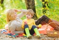 Family picnic. Mother pretty woman and little son relaxing forest picnic. Good day for spring picnic in nature. Having