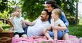 Family picnic outdoors togetherness relaxation happiness concept Royalty Free Stock Photo