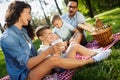 Family picnic outdoors togetherness relaxation happiness concept Royalty Free Stock Photo