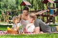 Family picnic on the playground Royalty Free Stock Photo