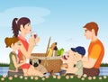 Family picnicking in the meadow Royalty Free Stock Photo