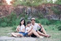 Family picnicking in the midst of nature with the cliff of background