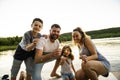 Family on the pier warm summer day having good time with bengal fires Royalty Free Stock Photo