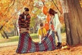 Family placing a picnic blanket