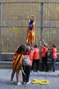 Family placing yellow ribbons on walls in Barcelona vertical