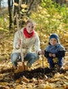 Family planting tree in autumn