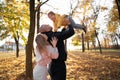 Family playing in autumn park having fun. Happy mother father and baby boy on autumn walk in the forest Royalty Free Stock Photo