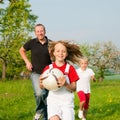 Family playing ballgames Royalty Free Stock Photo