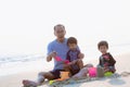 Family playing on the beach. Parents and children relaxing on the beach in the summer.happy healthy family Grandfather and Nephew Royalty Free Stock Photo