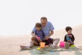 Family playing on the beach. Parents and children relaxing on the beach in the summer.happy healthy family Grandfather and Nephew Royalty Free Stock Photo