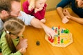 Family playing a board game