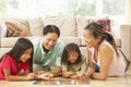 Family Playing Board Game At Home