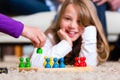 Family playing board game at home Royalty Free Stock Photo