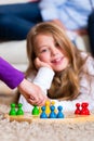 Family playing board game at home Royalty Free Stock Photo