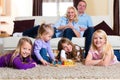 Family playing board game at home Royalty Free Stock Photo