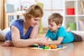 Family playing board game at home on the floor at home Royalty Free Stock Photo