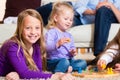 Family playing board game at home Royalty Free Stock Photo