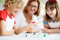 Family playing board game. Kids play Royalty Free Stock Photo