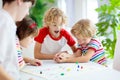 Family playing board game. Kids play Royalty Free Stock Photo