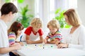 Family playing board game. Kids play Royalty Free Stock Photo