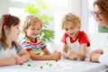 Family playing board game. Kids play Royalty Free Stock Photo