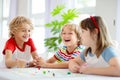 Family playing board game. Kids play Royalty Free Stock Photo